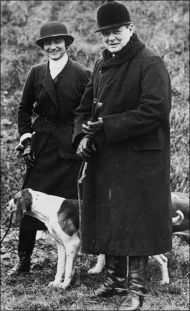 Winston Churchill and Coco Chanel with a dog photographed in the 1920s.