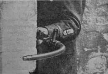 A soldier holding a krummlauf, a gun from World War One that was supposed to be able to shoot around the corner.