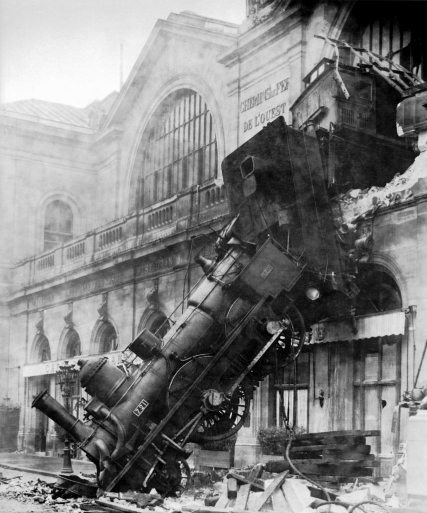 Train that has smashed through the side of the station and crashing into the ground.