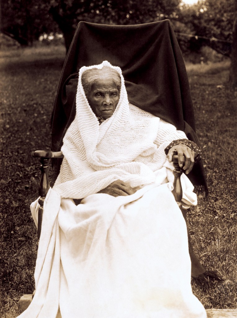 Harriet Tubman at the age of 89 in 1911 sitting on a chair.