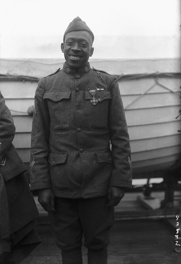 Sergeant William Henry "Black Death" Johnson of the 369th Infantry Regiment (Harlem Hellfighters) wearing his Croix de Guerre medal in circa 1918. 