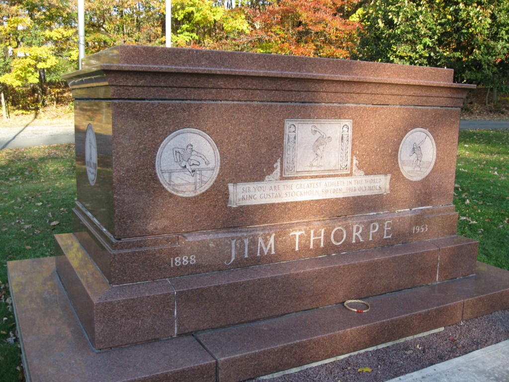 the memorial of Jim Thorpe located in Jim Thorpe Pennsylvania. It has his name in large letters and shows different sports he has taken part in.