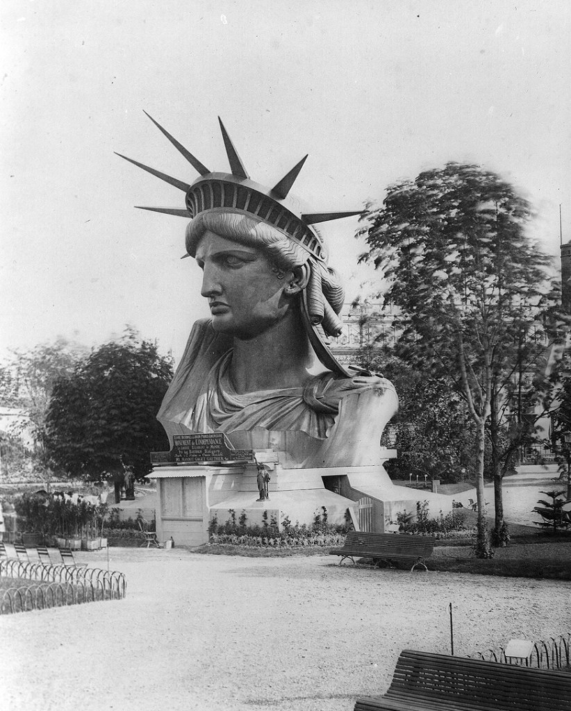 The head of the Statue of Liberty on display in a park in Paris, France at the World Fair in 1878.