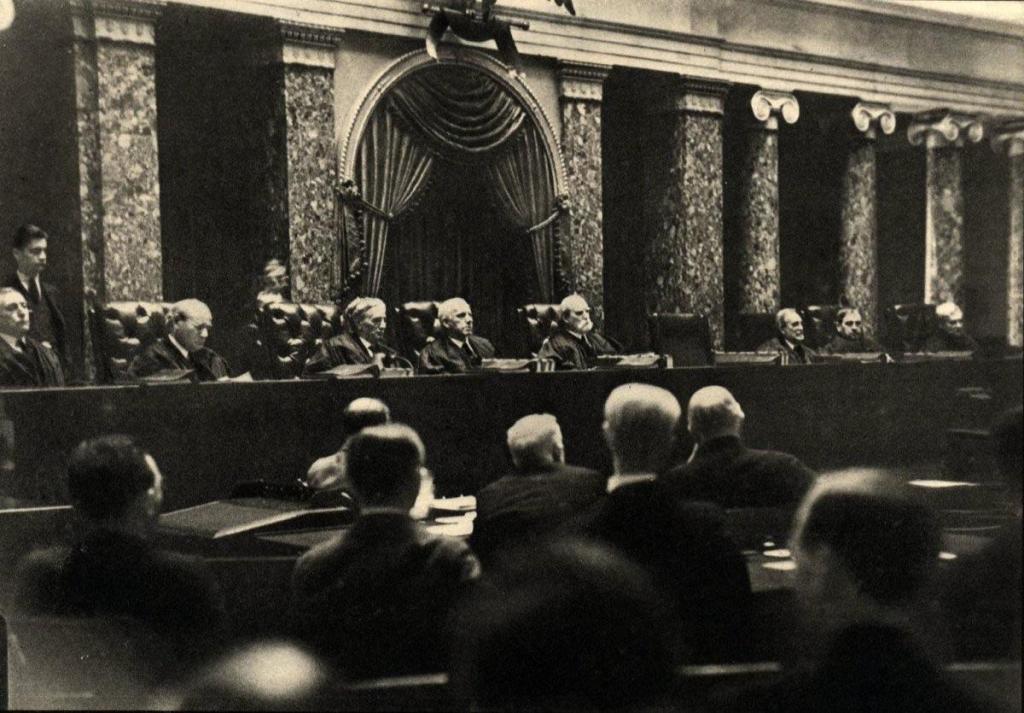 One of only two photos that exist of the US Supreme Court in session, photographer Erich Salomon pretended to have a broken arm, and hid a camera in his cast to take this image. It is illegal for cameras to be in the courtroom while the US Supreme Court is in session. This was taken in 1932 during the Hughes Court.