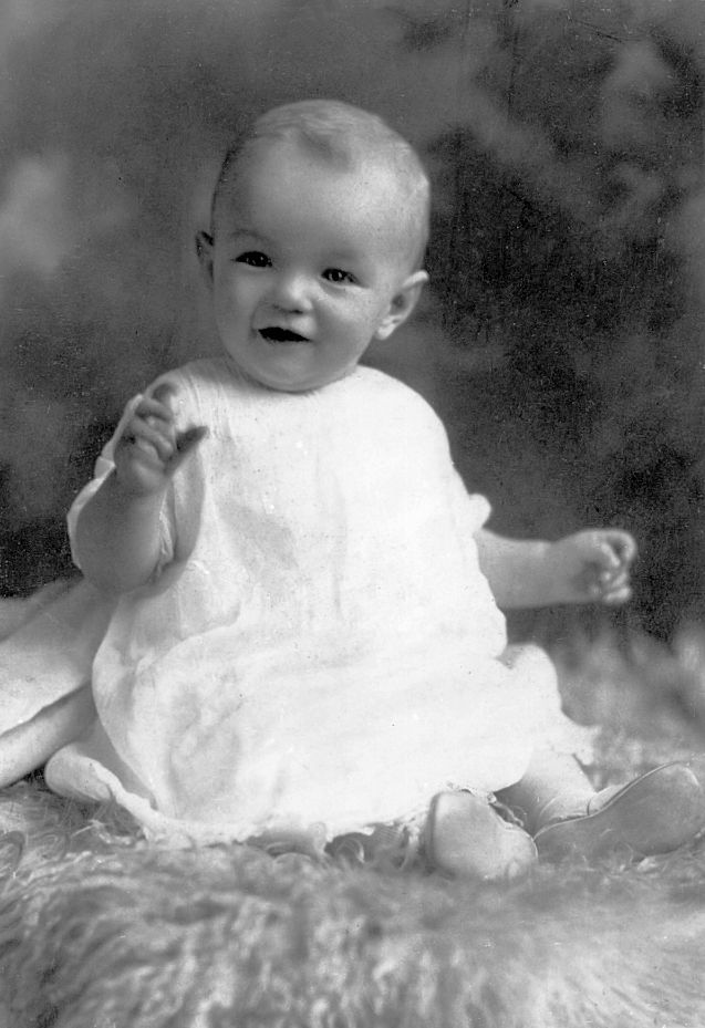 Marilyn Monroe as a baby in 1927 having a professional photo of her taken.