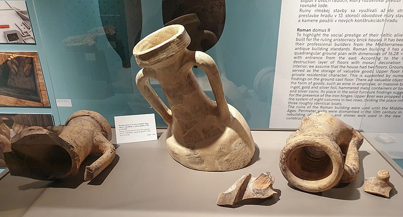 A museum exhibit photographed showing tubs that were used for wine.