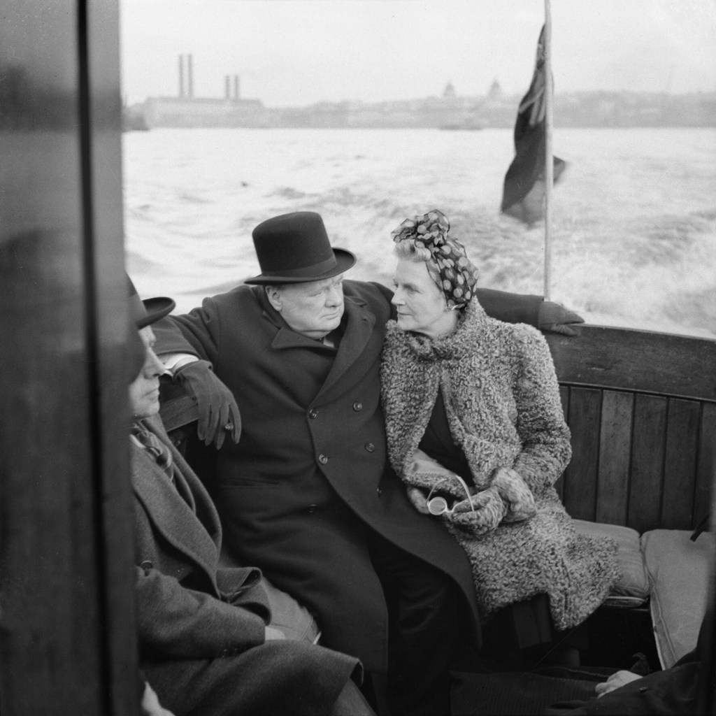 Winston Churchill and Clementine Churchill sitting on a boat close together. September 1940.