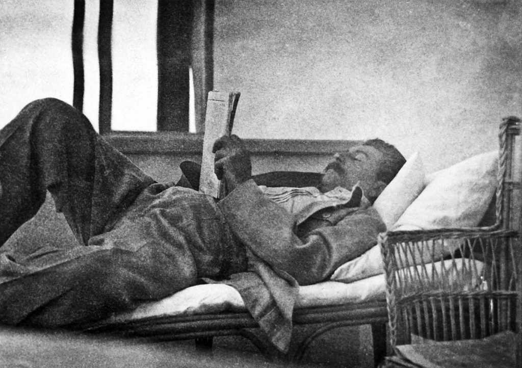 Joseph Stalin reading newspapers, from the archives of Evgeny Kovalenko. 1920