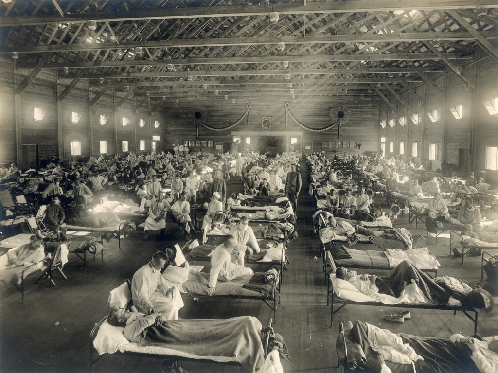  Beds with patients in an emergency hospital in Camp Funston, Kansas, in the midst of the influenza epidemic. The flu struck while America was at war, and was transported across the Atlantic on troop ships.