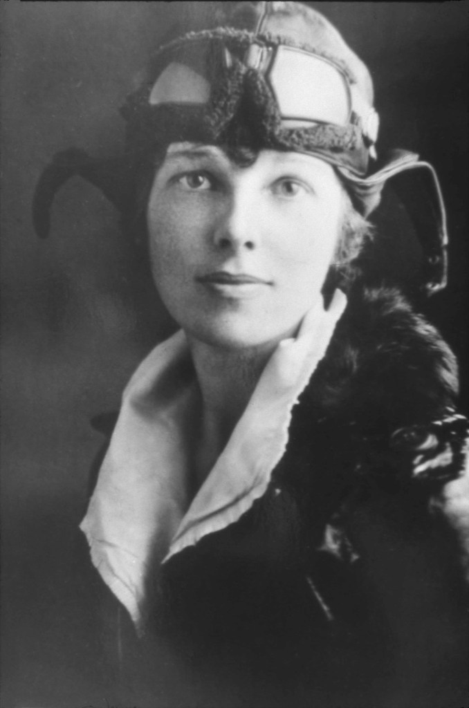 Amelia Earhart dressed to fly.