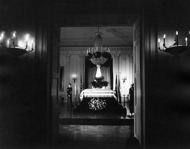 The body of President John. F. Kennedy lies in repose in the East Room of the White House.
