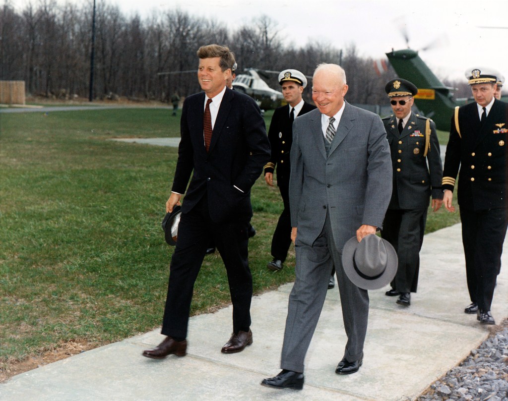 Meeting with President Eisenhower. President Kennedy, President Eisenhower, military aides. Camp David, MD