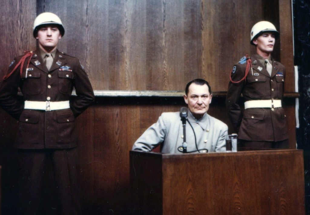 German Reichsmarschall, Commander of the Luftwaffe Hermann Goering (1893 - 1946) during cross examination at his trial for war crimes in Room 600 at the Palace of Justice during the International Military Tribunal (IMT), Nuremberg, Germany, 1940s.