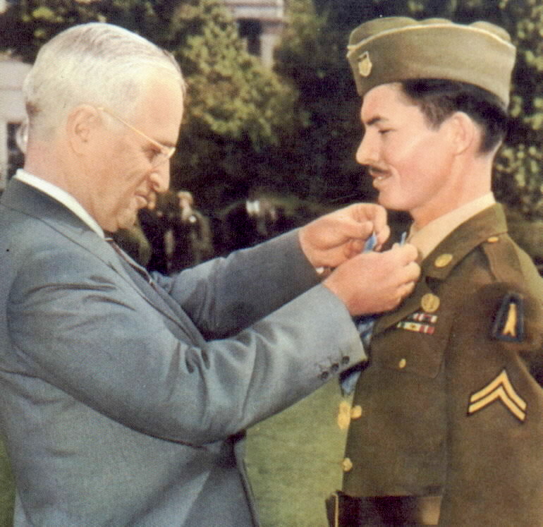 President Harry Truman awarding the Medal of Honor to conscientious objector Desmond Doss