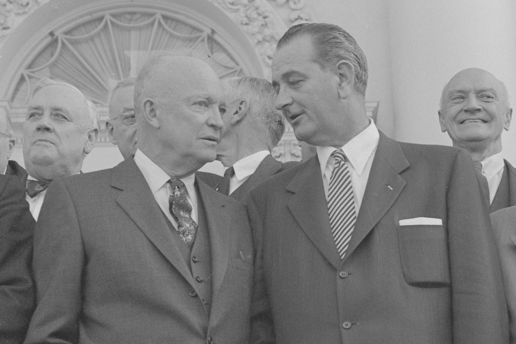 President Dwight D. Eisenhower standing with Lyndon B. Johnson (center),John Foster Dulles (right) and other guests, during a bipartisan luncheon at the White House, Washington, D.C.