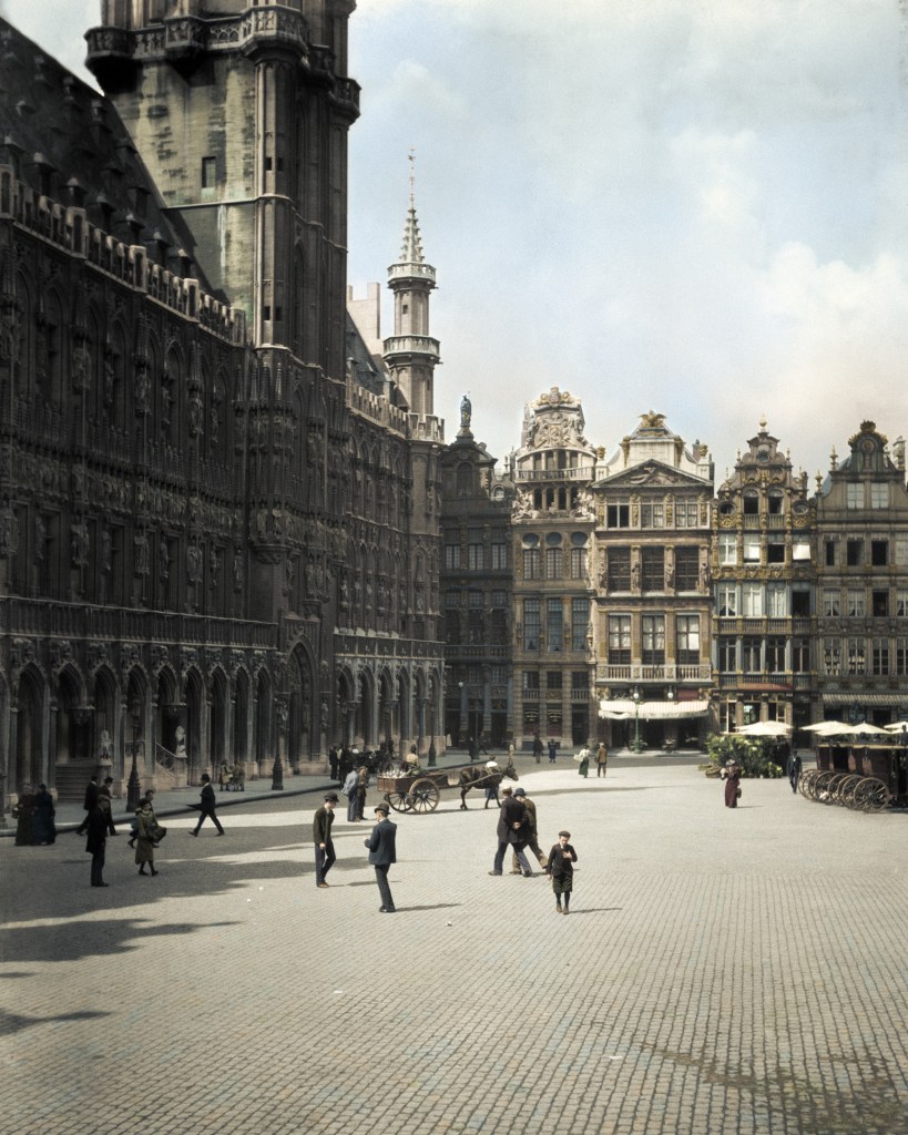 The Grand Place in Brussels, Belgium photographed in 1904. La Grand-Place is the central square in the capital city of Belgium. Colorized by Baptiste Pierre