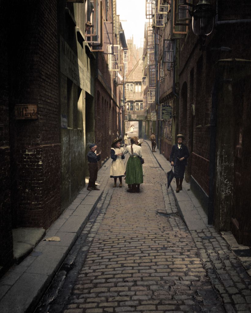 A group of children dressed up in smart attire, likely to attend church, standing on Karpfangerstraße, a street located in Hamburg, Germany. Photograph taken in circa 1904.
