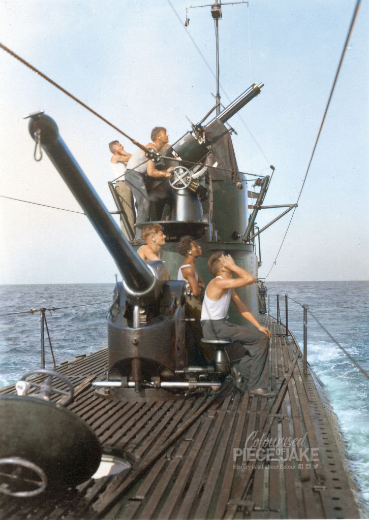 The crew of the Dutch submarine Hr.Ms. K XV moves the 40mm Vickers machine gun into position for testfire, circa 1939. colorized by Colourised Piece of Jake