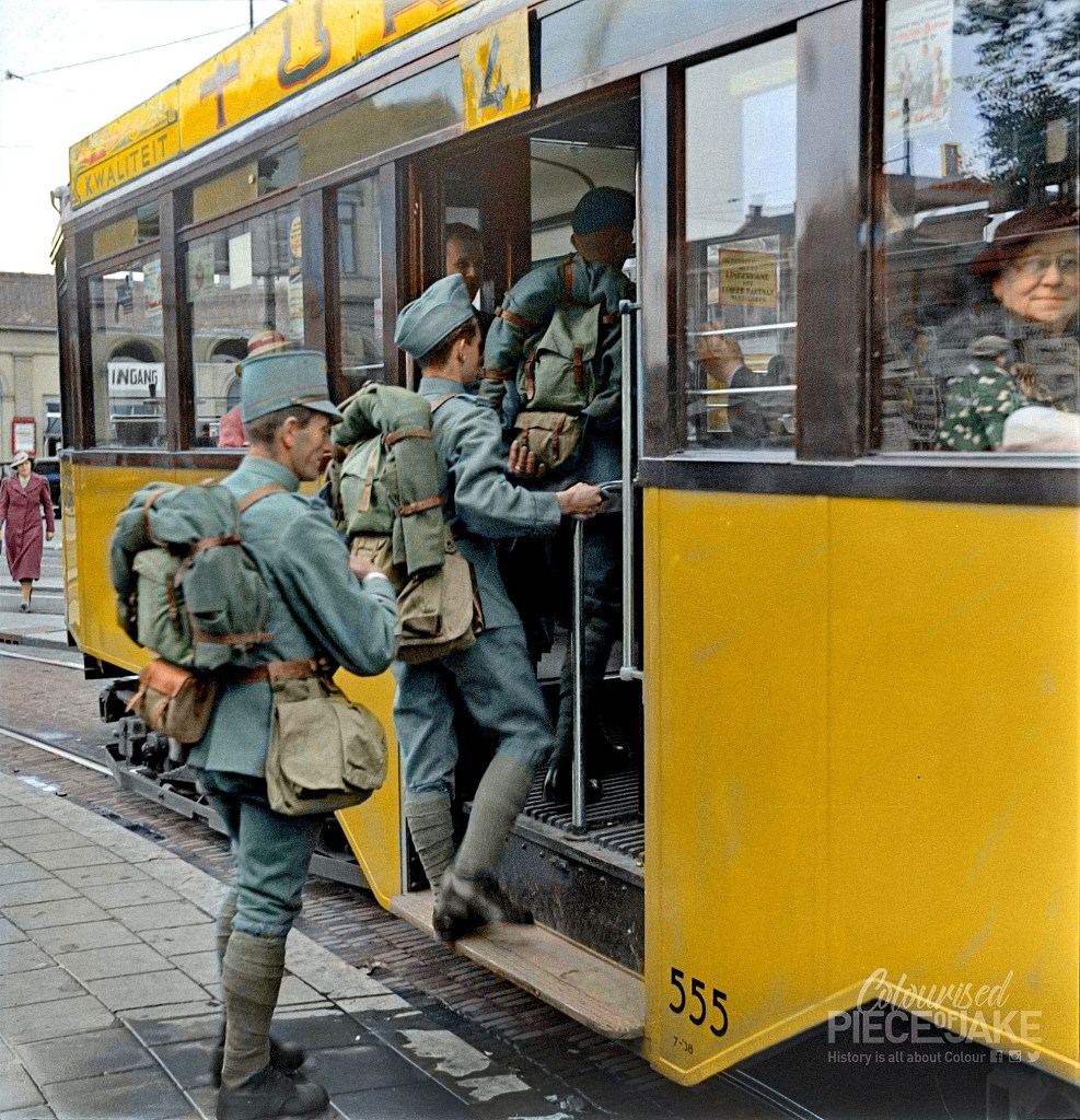 Colorized photo of soldiers boarding a tram in Rotterdam during World War 2 mobilization. Colorized by Colourised Piece of Jake