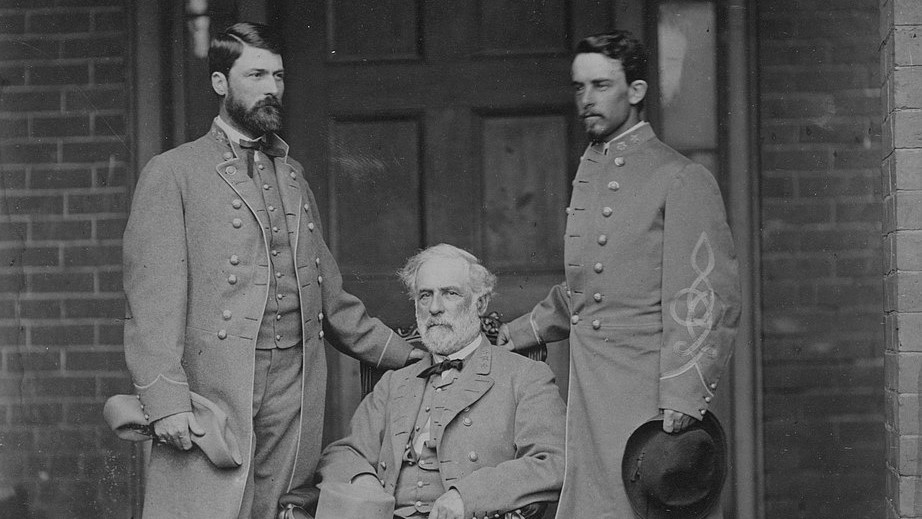Photograph shows portrait of Lee seated with George Washington Custis Lee and Walter H. Taylor standing, 1865