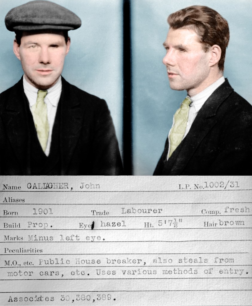 1930s Mugshot and police description of a man named John Gallagher in a white shirt and a black suit with a yellow tie. He is wearing a grey flat cap and has brown hair and one hazel eye. The photograph has been colorized