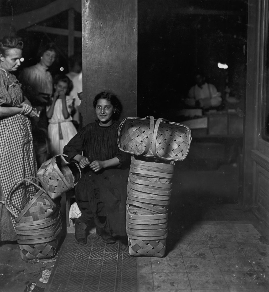 Original description form the National Child Labor Committee: Lena Lochiavo, 11 years old, Basket Seller, Sixth St. Market, Cincinnati O. Saloon entrance. 11 P.M. Had been there since 10 A.M. and not yet sold out. Location: Cincinnati, Ohio.