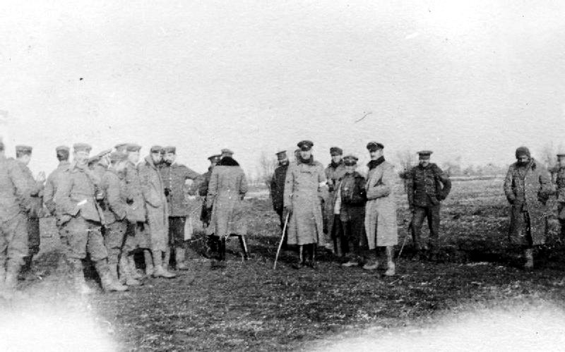 Description: British and German troops meeting in No-Mans's Land during the unofficial truce. (British troops from the Northumberland Hussars, 7th Division, Bridoux-Rouge Banc Sector)