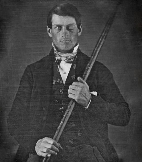 Phineas Gage in formal wear while holding his inscribed tamping iron across his body.